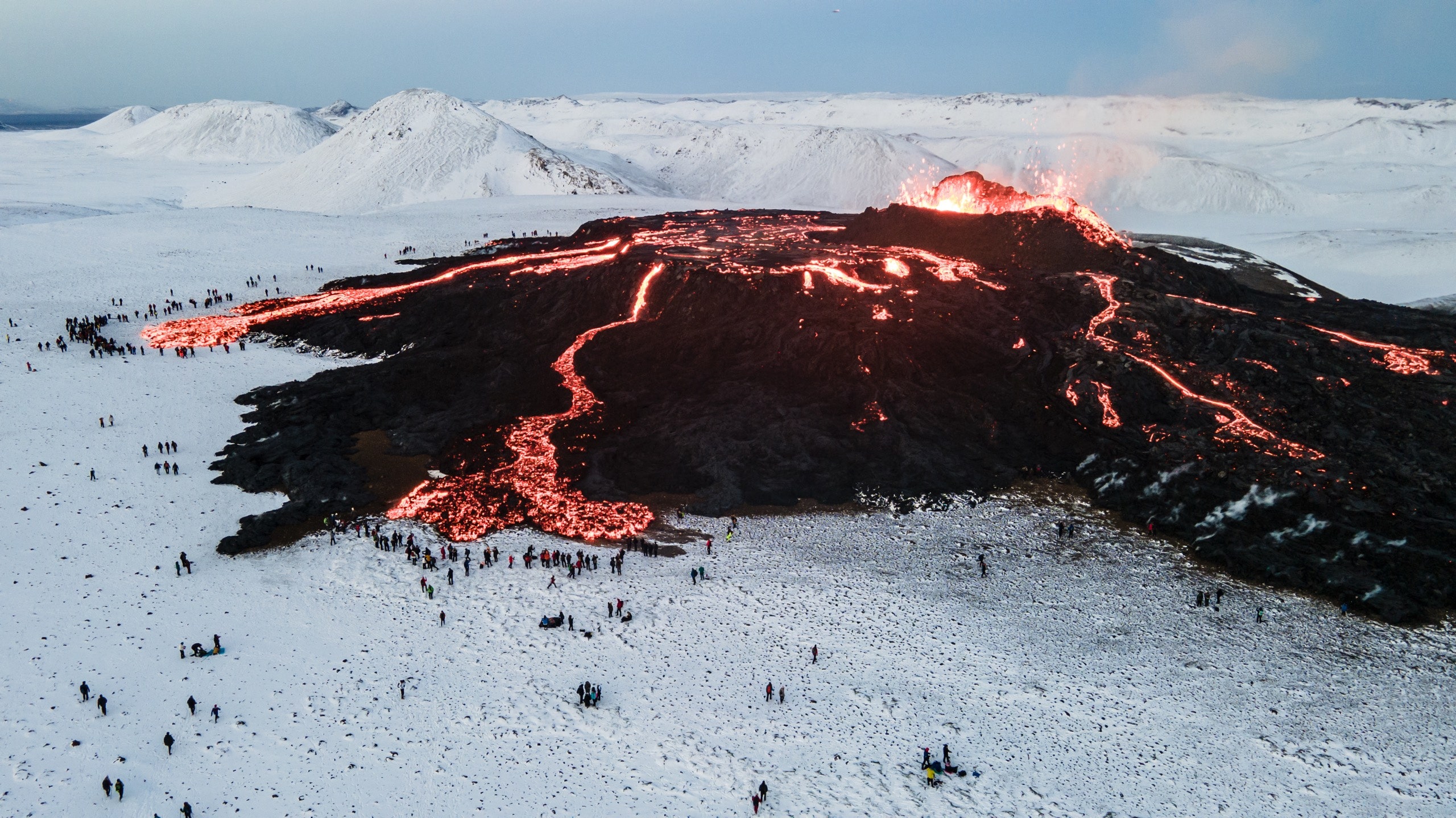 People gather around the Fagradalsfjall volcano