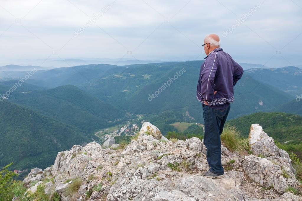 depositphotos_28324885-stock-photo-senior-man-standing-on-top.jpg