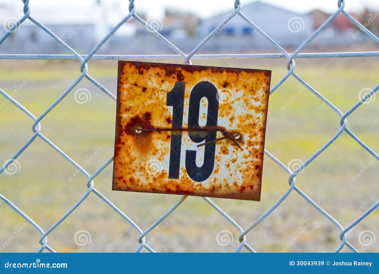 series-rusted-old-signs-tags-attached-to-chain-link-fence-orange-white-rust-numbers-clearly-visible-30043939.jpg