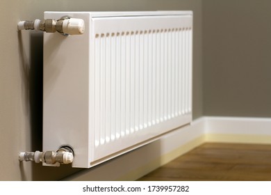 white-metal-heating-radiator-mounted-260nw-1739957282.jpg